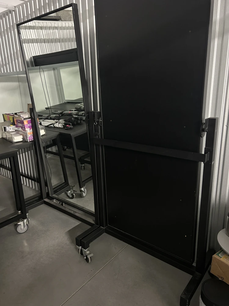 Rolling full length pivoting mirrors