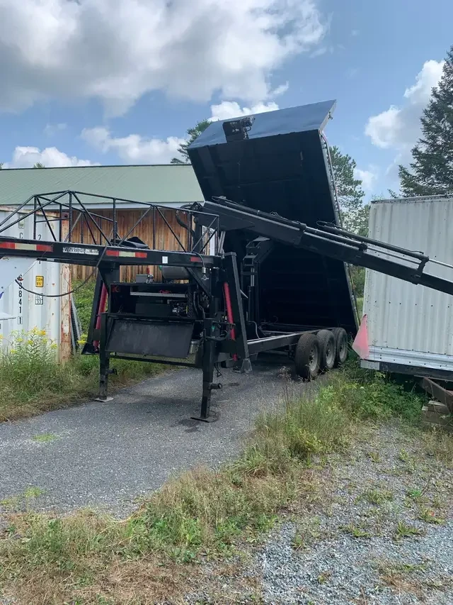 Crane trailer with dump